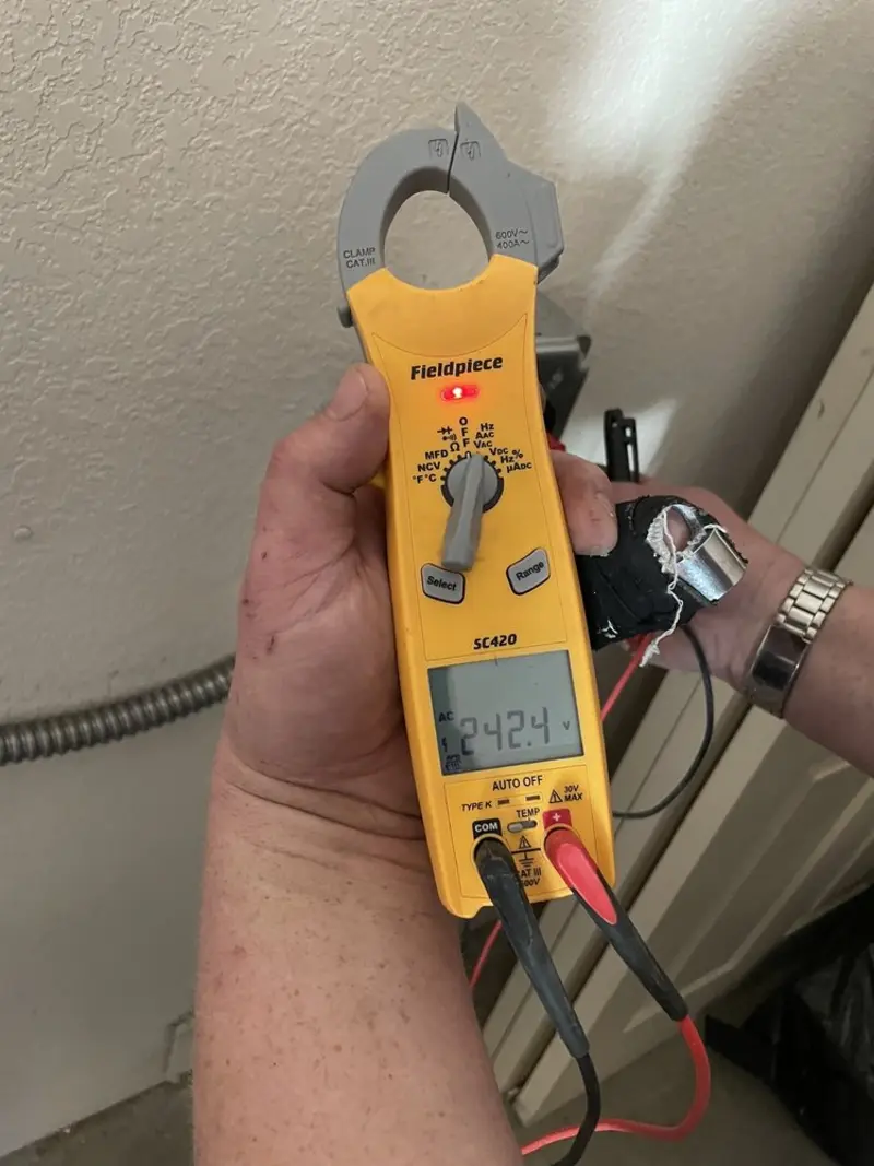 Voltage testing with clamp meter during Ceiling Fan Installation in Ridgewood village